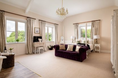 A king-size bedroom at The Victorian Manor, Dorset