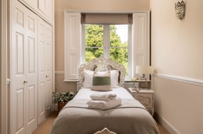 A twin bedroom at The Victorian Manor, Dorset