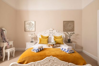 A king-size bedroom at The Victorian Manor, Dorset
