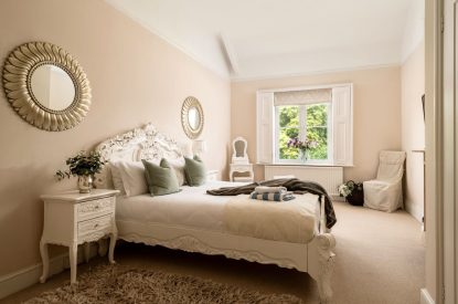 A king-size bedroom at The Victorian Manor, Dorset