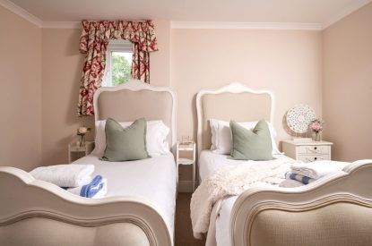 A twin bedroom at The Victorian Manor, Dorset