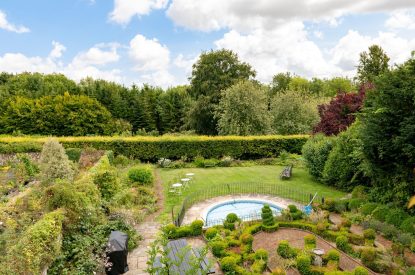 The garden and swimming pool at The Victorian Manor, Dorset
