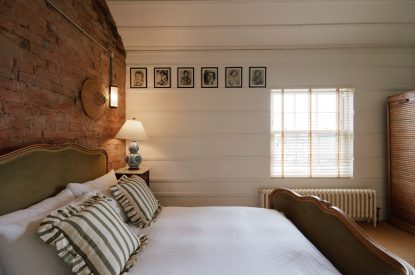 A king-size bedroom at Sutton Farmhouse, Leicestershire
