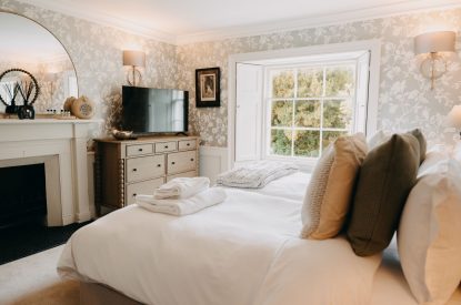 A king-size bedroom at Stoke Hall, Nottinghamshire
