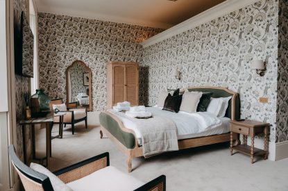 A king-size bedroom at Stoke Hall, Nottinghamshire