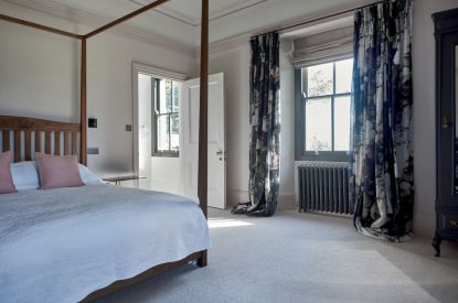 A king-size four poster bed at Bracken Grange, Ceredigion