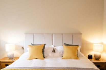 A super-king-size bedroom at Malbank Barn, Cheshire