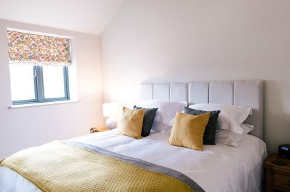 A super-king-size bedroom at Malbank Barn, Cheshire