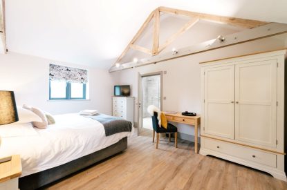 A super-king-size bedroom at Malbank Barn, Cheshire