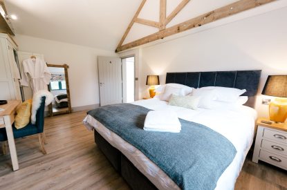 A super-king-size bedroom at Malbank Barn, Cheshire