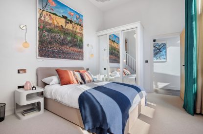 A king-size bedroom at The Wivenhoe Hideaway, Essex