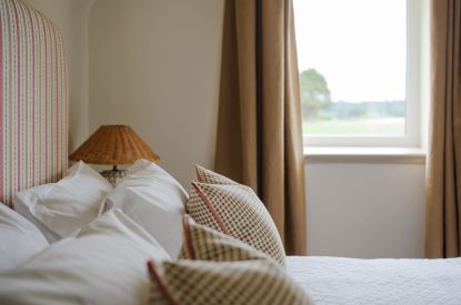 A super-king-size bedroom at Isla Farmhouse, Perthshire