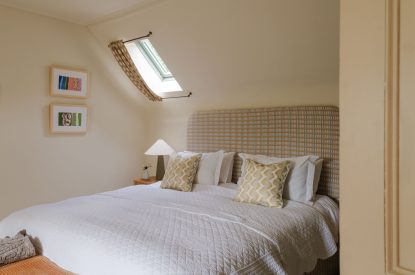 A super-king-size bedroom at Isla Farmhouse, Perthshire