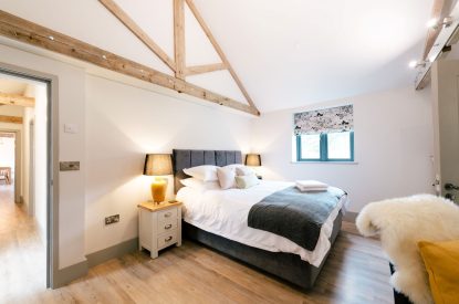 A super-king-size bedroom at Malbank Barn, Cheshire