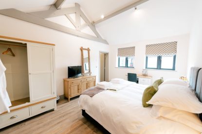 A super-king-size bedroom at Malbank Barn, Cheshire