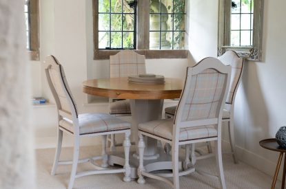 The four-seater dining table and chairs in the reception room at Wild Rose Cottage, Cotswolds