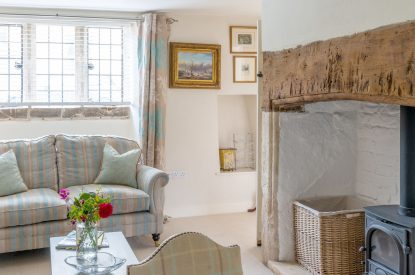 The two-seater sofa in the reception room at Wild Rose Cottage, Cotswolds