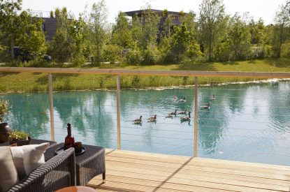 The balcony with lake view at Lakeside Cabin, Cotswolds