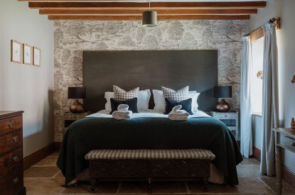 A super-king-size bedroom at The Mill Courtyard, Herefordshire