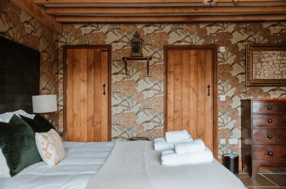 A super-king-size bedroom at The Wainhouse Courtyard, Herefordshire 