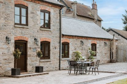 Outdoor dining space at The Courtyards at Lyonshall, Herefordshire