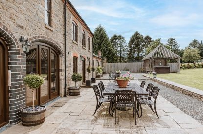 Outdoor dining space at The Courtyards at Lyonshall, Herefordshire